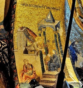 12- Virgin seated on an altar in the church is taking bread from the archangel Gabriel. She has the monogram ‘’Theotokos’’ over her head. 